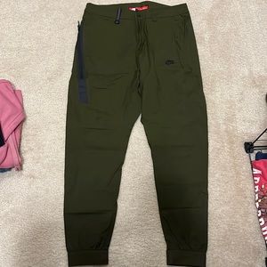 Army green Nike jogger pants